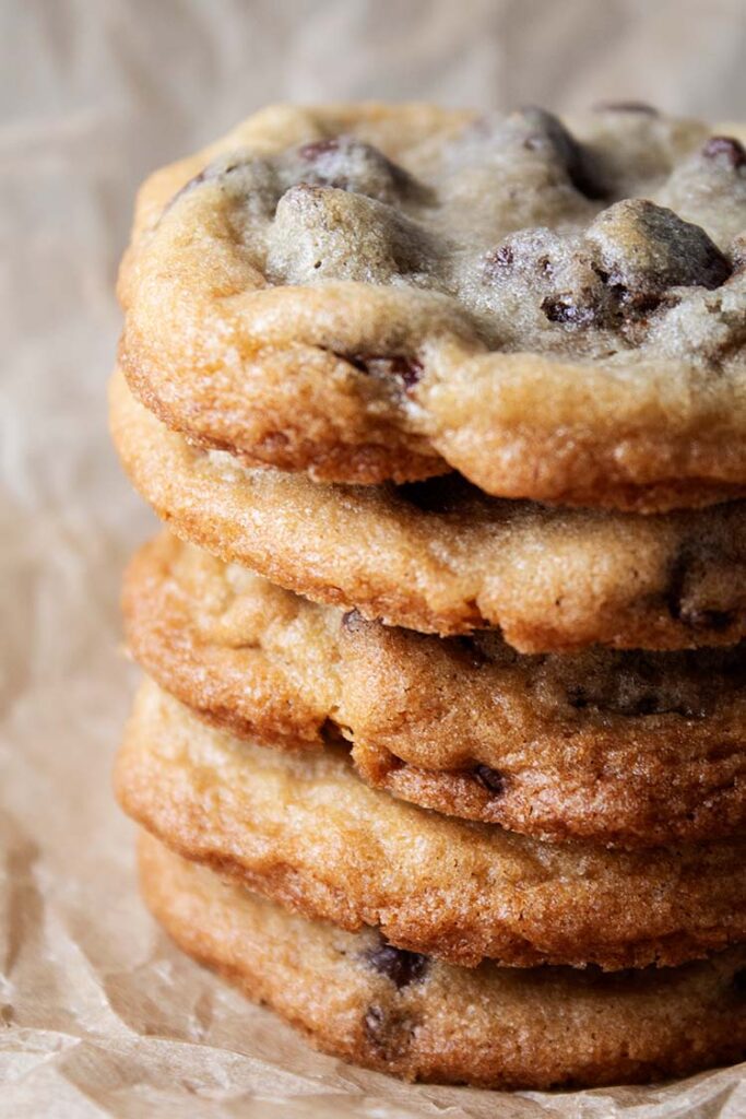 stack of 5 tasty homemade soft chocolate chip cookies on countertop