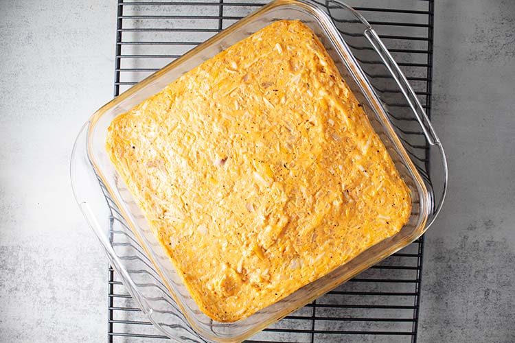 overhead view of buffalo chicken casserole with cauliflower after baking and ready for cheese topping