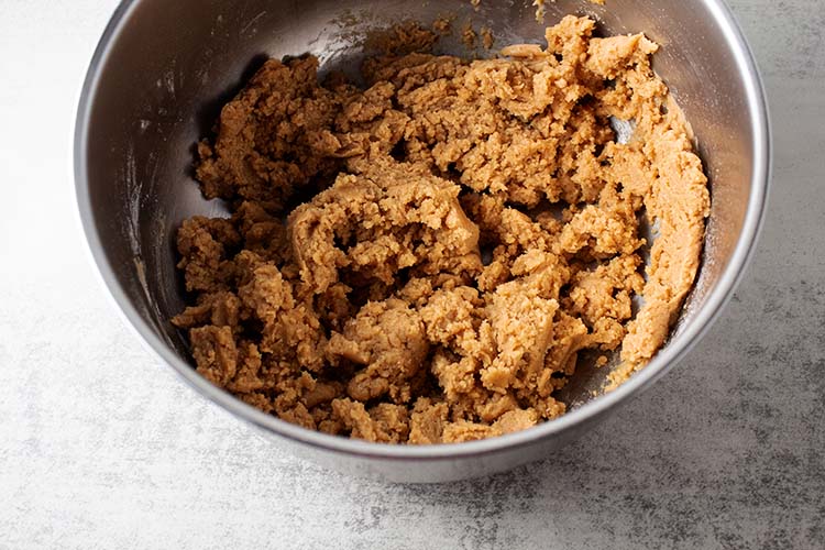 inside of bowl with peanut butter blossoms dough