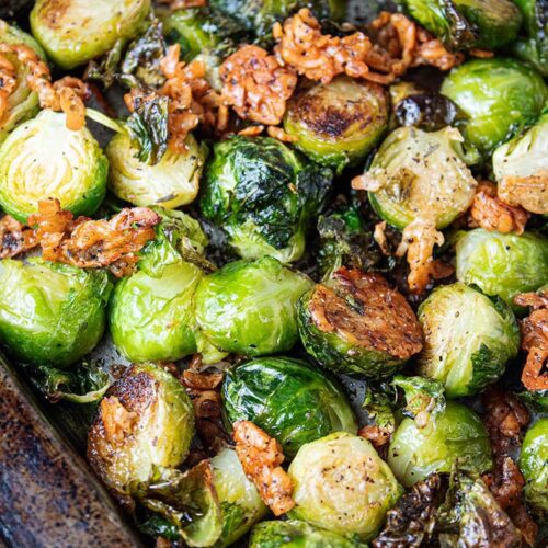 overhead view of oven roasted brussels sprouts baked on a sheet pan