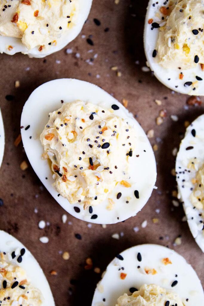 overhead closeup view of deviled eggs with everything bagel seasoning sprinkled on top