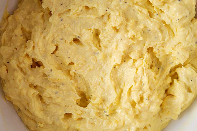 overhead view of creamy yolk mixture mixed and ready to be placed into each egg half