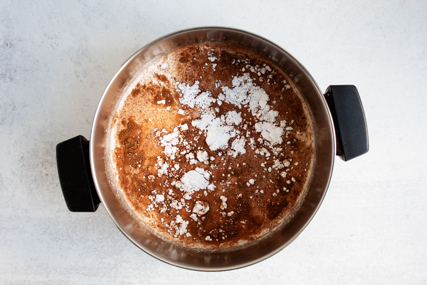 overhead view of eggnog mixture in pot ready to be cooked