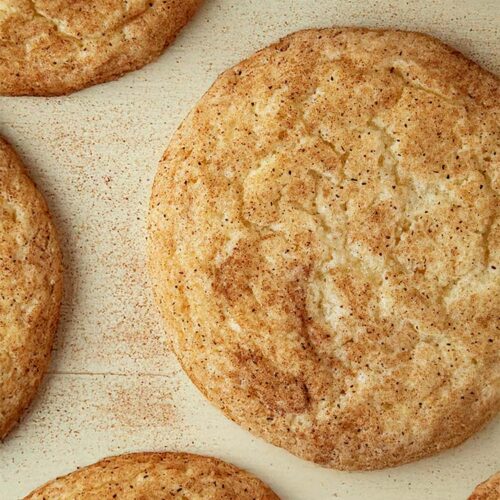 overhead view of ready to serve snickerdoodle cookies on waxed paper
