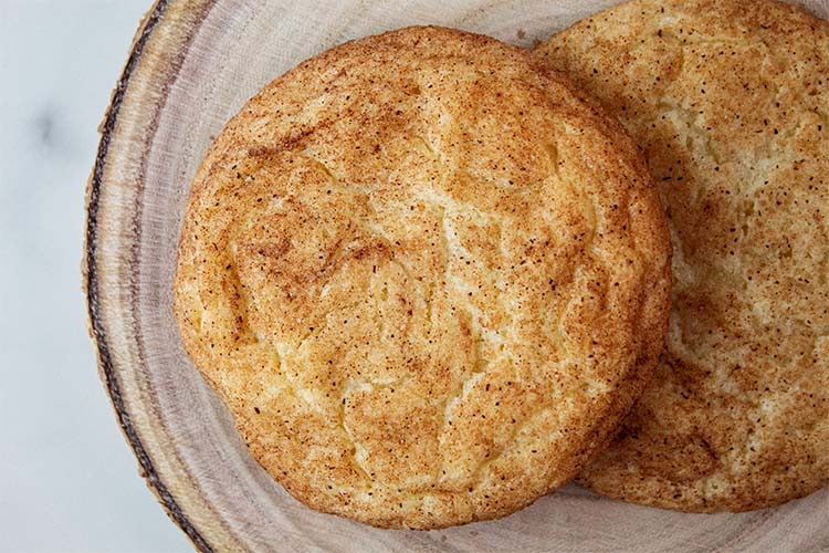 overhead view of homemade snickerdoodle cookies on a dish ready to be served