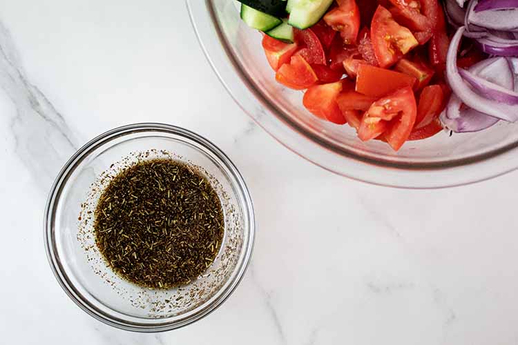 overhead view of dressing ready to be added to the tossed vegetables