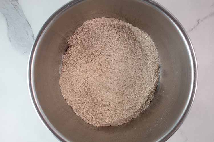 overhead view of dry ingredients in a mixing bowl fully combined