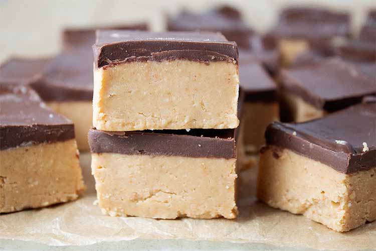 sideview of individual no-bake peanut butter bars cut and spaced out ready to be served