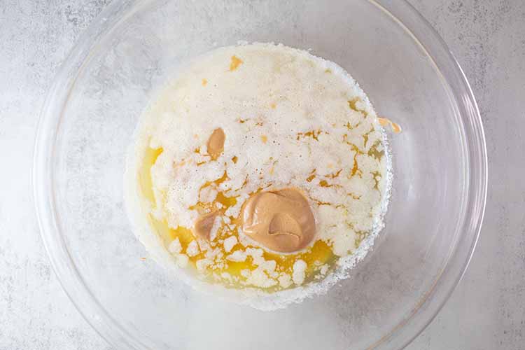 overhead view of butter and peanut butter melted and combined