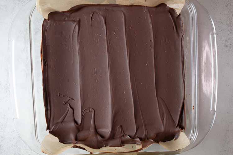 overhead view of no-bake peanut butter bar removed from the fridge and ready to be cut into squares