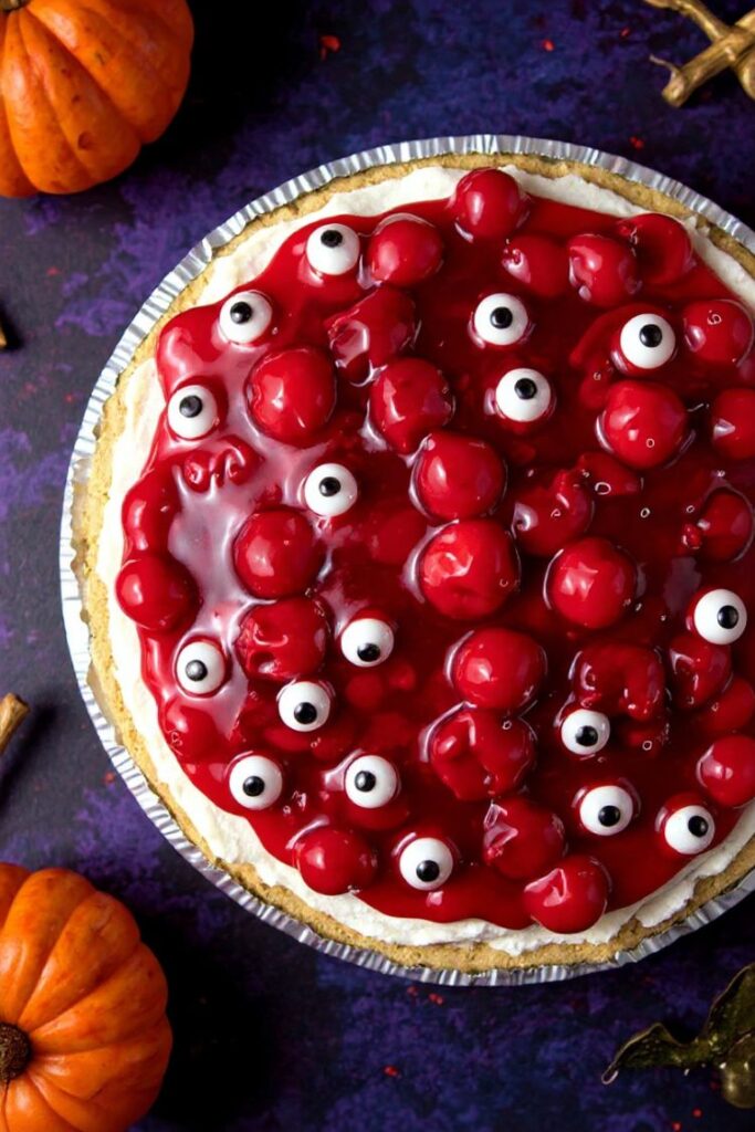 overhead view of Halloween no-bake cherry cheesecake topped with spooky eyeballs